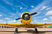 Bright yellow propellor aircraft