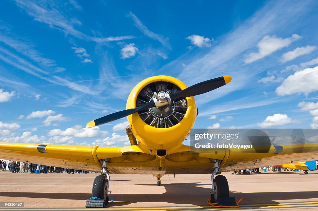 Bright yellow propellor aircraft