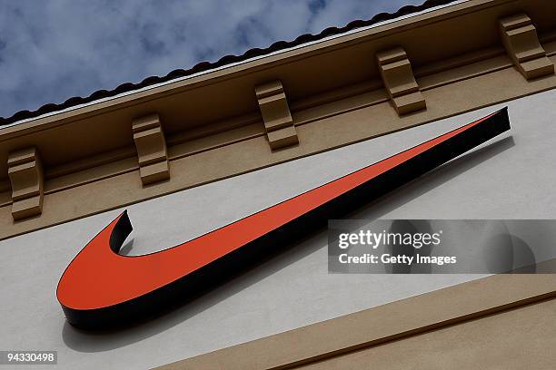 The "Swoosh" logo is seen on a Nike factory store on December 12, 2009 in Orlando, Florida. Tiger Woods announced that he will take an indefinite...