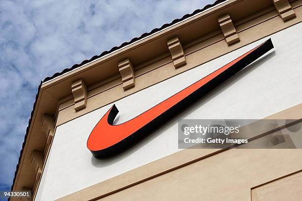 The "Swoosh" logo is seen on a Nike factory store on December 12, 2009 in Orlando, Florida. Tiger Woods announced that he will take an indefinite...