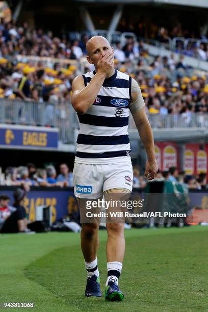 Gary Ablett of the Cats leaves the field with a possible hamstring injury during the round three AFL match between the West Coast Eagles and the...