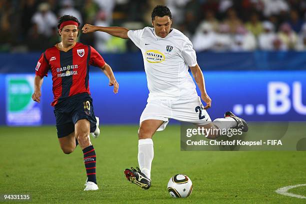 Greg Uhlmann of Auckland City shoots the ball and is followed by Gerardo Ruiz of Atlante during the FIFA Club World Cup quarter-final match between...