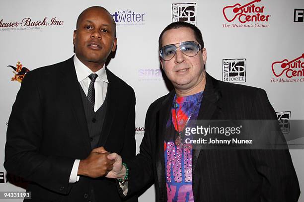 Kevin Powell and artist Noah G. Pop attend Kevin Powell's 9th annual holiday party and clothing drive at Tribeca Cinemas on December 11, 2009 in New...