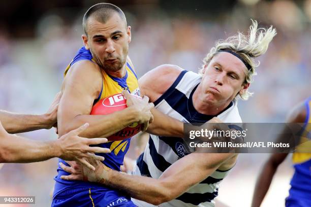 Dom Sheed of the Eagles is tackled by Mark Blicavs of the Cats during the round three AFL match between the West Coast Eagles and the Geelong Cats at...