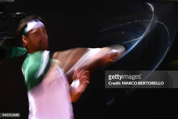Italy's Fabio Fognini hits a return to France's Lucas Pouille during the Davis Cup quarter final Italy vs France on April 8, 2018 at the 'Valletta...