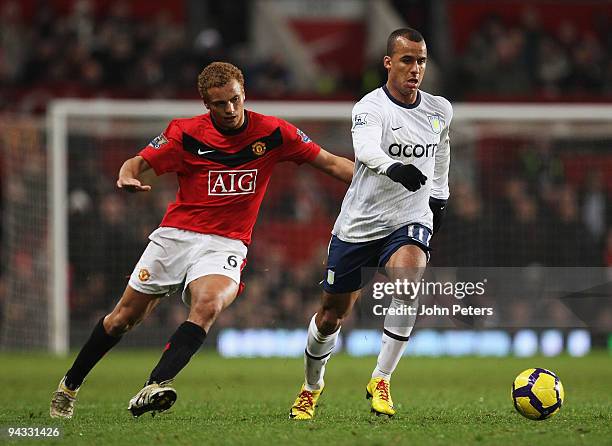 Wes Brown of Manchester United clashes with Gabriel Agbonlahor of Aston Villa during the FA Barclays Premier League match between Manchester United...