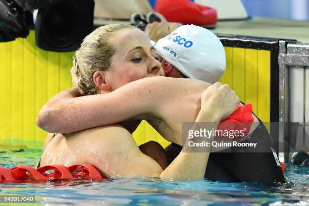 Siobhan Marie O'Connor of England embraces Hannah Miley of Scotland following the Women's 200m Individual Medley Final on day four of the Gold Coast...