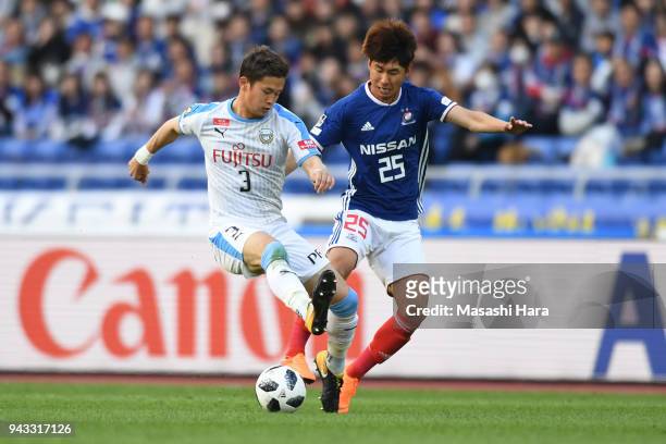 Tatsuki Nara of Kawasaki Frontale and Yun Il Lok of Yokohama F.Marinos compete for the ball during the J.League J1 match between Yokohama F.Marinos...