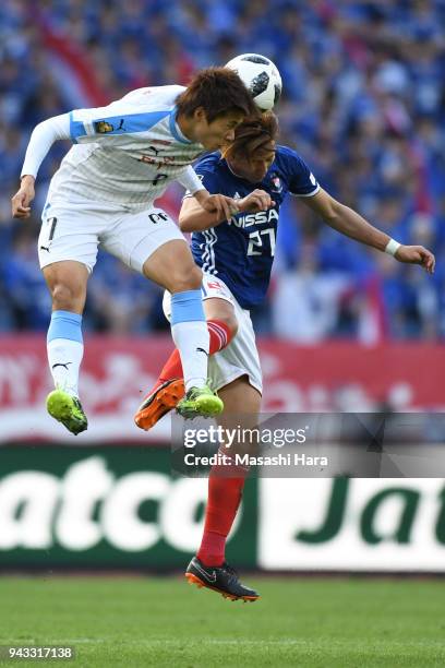Shintaro Kurumaya of Kawasaki Frontale and Ken Matsubara of Yokohama F.Marinos compete for the ball during the J.League J1 match between Yokohama...