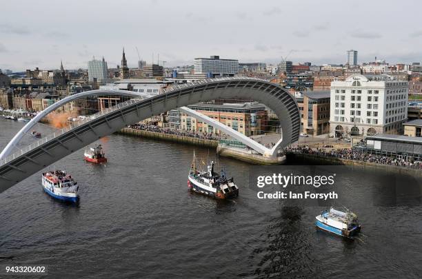 Fishing boats pass under the Millenium Bridge on the River Tyne in North Shields as fishermen take part in a nationwide protest against the Brexit...