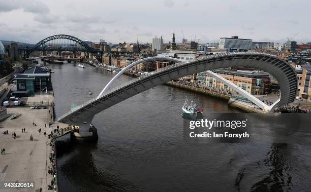 Fishing boats pass under the Millenium Bridge on the River Tyne in North Shields as fishermen take part in a nationwide protest against the Brexit...