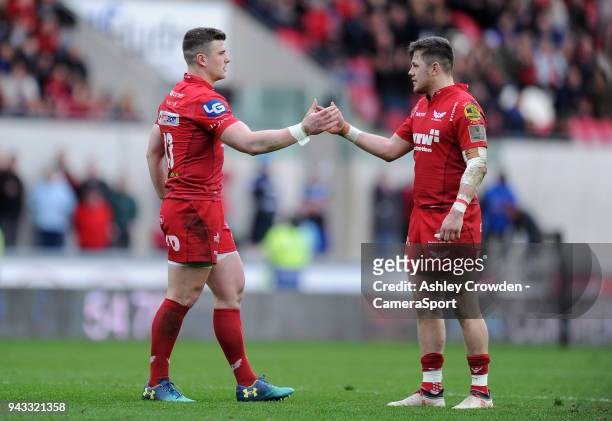Scarlets' Scott Williams and Steffan Evans shake hands during the game during the Guinness PRO14 Round 19 match between Scarlets and Glasgow Warriors...
