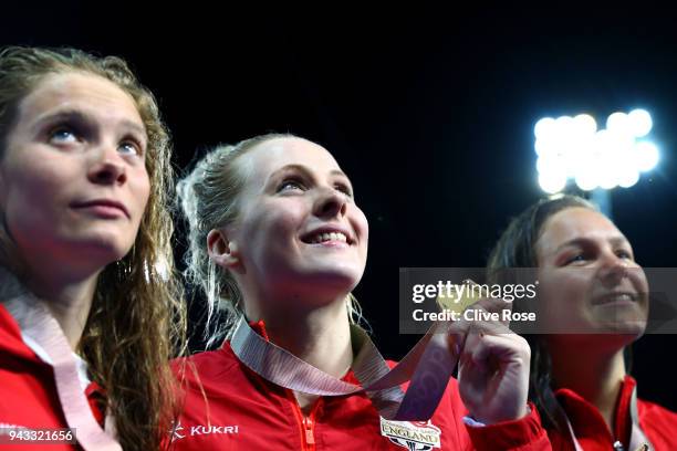 Silver medalist Sarah Darcel of Canada, gold medalist Siobhan Marie O'Connor of England and bronze medalist Erika Seltenreich-Hodgson of Canada pose...