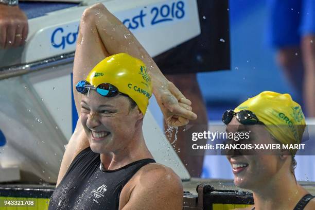 Australia 's Cate Campbell celebrates next to Australia's Madeline Groves after the swimming women's 50m butterfly final during the 2018 Gold Coast...