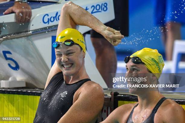 Australia 's Cate Campbell celebrates next to Australia's Madeline Groves after the swimming women's 50m butterfly final during the 2018 Gold Coast...
