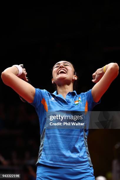 Manika Batra of India celebrates her win over Yihan Zhou of SIngapore to win the gold medal in their Womens Team gold medal match during Table Tennis...