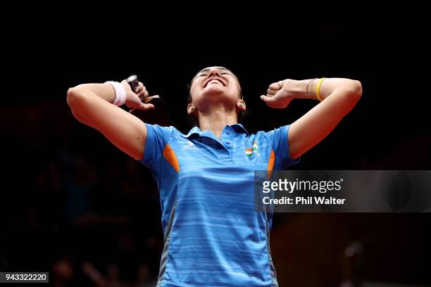 Manika Batra of India celebrates her win over Yihan Zhou of SIngapore to win the gold medal in their Womens Team gold medal match during Table Tennis...