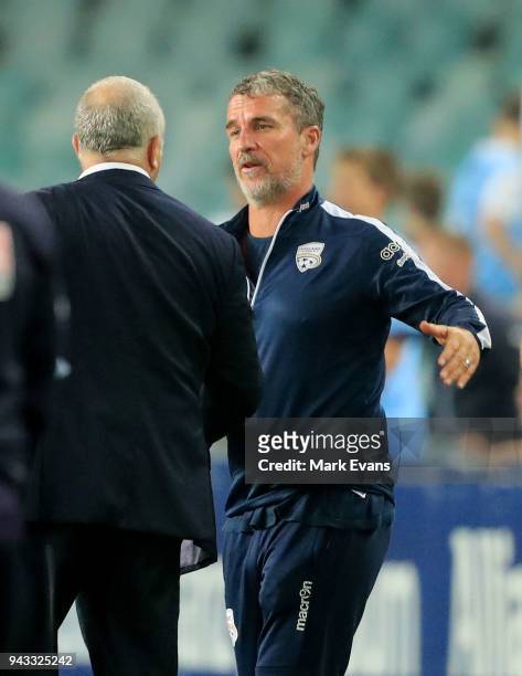 Marco Kurz, Head Coach of Adelaide United congratulates Graham Arnold, Coach of Sydney FC after the round 26 A-League match between Sydney FC and...