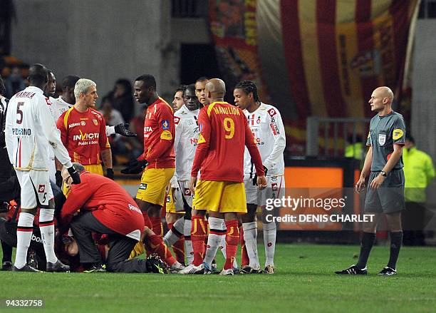 French referee Tony Chapron looks on after Nice's Mamadou Bagayoko commited a fault and injured Len's Nenad Kovacevic during the French L1 football...