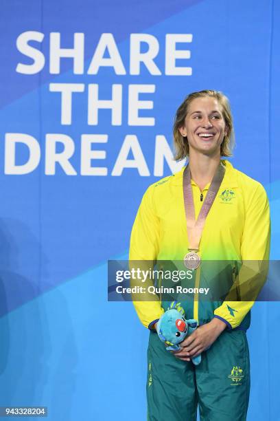 Bronze medalist Madeline Groves of Australia poses during the medal ceremony for the Women's 50m Butterfly Final on day four of the Gold Coast 2018...