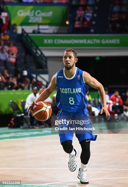 Bantu Burroughs of Scotland dribbles the ball during the Preliminary Basketball round match between India and Scotland on day four of the Gold Coast...