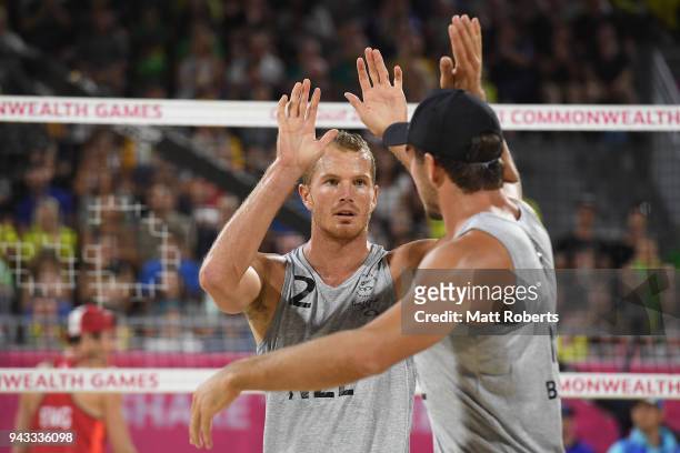 Sam O'Dea and Ben O'Dea of New Zealand celebrate during the Beach Volleyball Men's Preliminary round against Jake Sheaf and Chris Gregory of England...