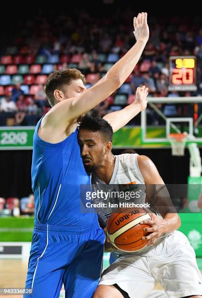 Amjyat Gill of India collides with Michael Vigor of Scotland during the Preliminary Basketball round match between India and Scotland on day four of...