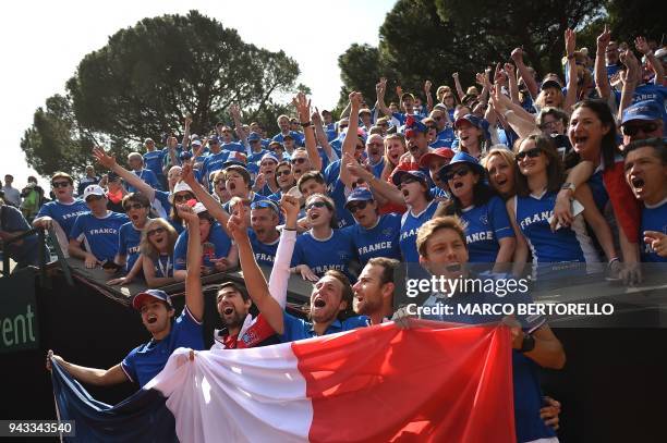 France's team players Pierre-Hugues Herbert, Jeremy Chardy, Lucas Pouille, Adrian Mannarino and Nicolas Mahut celebrate after winning the Davis Cup...