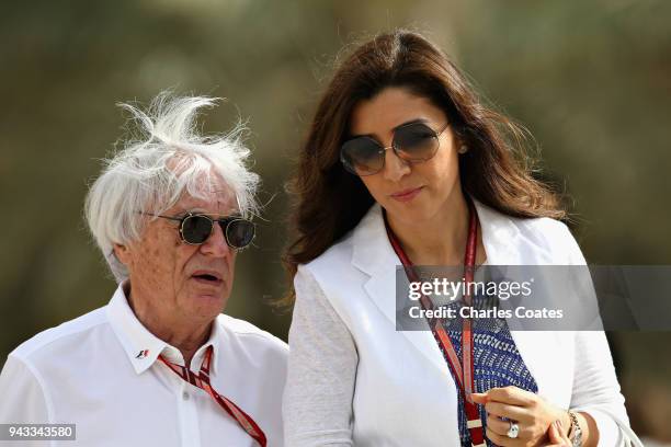 Bernie Ecclestone, Chairman Emeritus of the Formula One Group, talks in the Paddock with wife Fabiana before the Bahrain Formula One Grand Prix at...