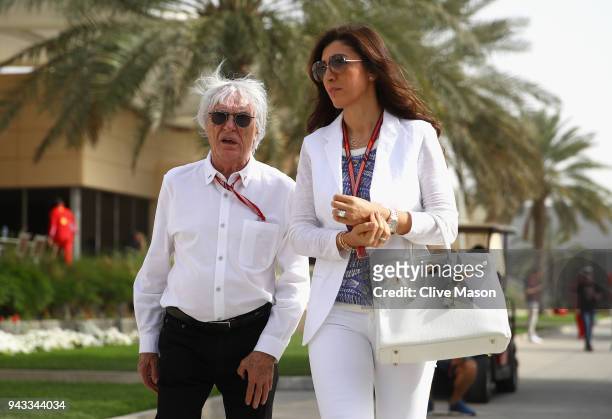 Bernie Ecclestone, Chairman Emeritus of the Formula One Group, talks in the Paddock with wife Fabiana before the Bahrain Formula One Grand Prix at...