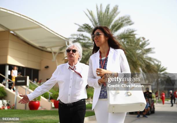 Bernie Ecclestone, Chairman Emeritus of the Formula One Group, talks in the Paddock with wife Fabiana before the Bahrain Formula One Grand Prix at...