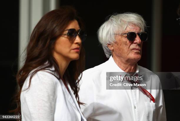 Bernie Ecclestone, Chairman Emeritus of the Formula One Group, looks on in the Paddock with wife Fabiana before the Bahrain Formula One Grand Prix at...