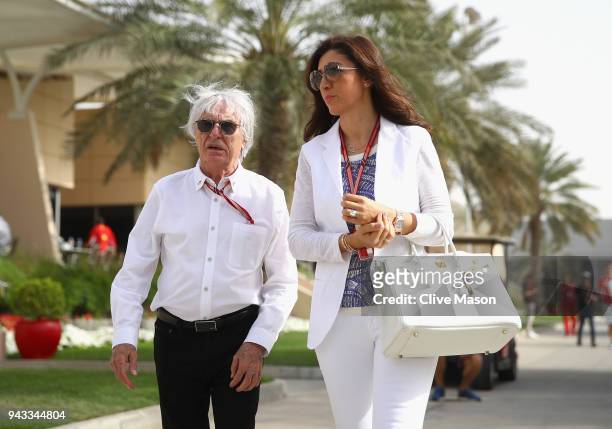 Bernie Ecclestone, Chairman Emeritus of the Formula One Group, talks in the Paddock with wife Fabiana before the Bahrain Formula One Grand Prix at...