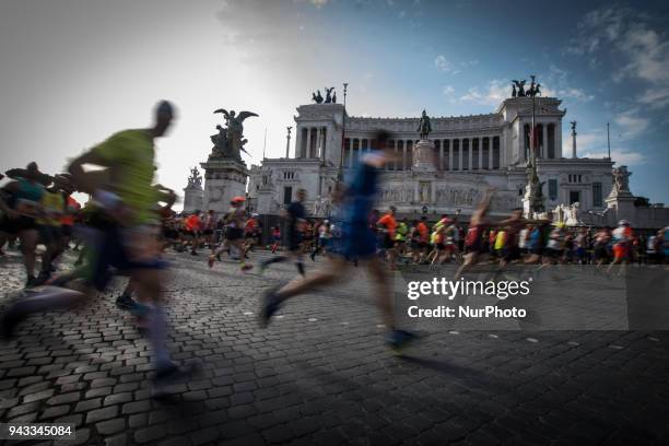 Athletes run in Piazza Venezia Square after the start of the Rome City Marathon, Sunda the XXIV edition of the Rome Marathon, on April 8, 2018 in...