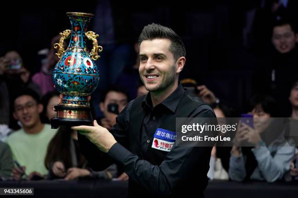 Mark Selby of England poses with the trophy after beating Barry Hawkins of England in the final of the 2018 China Open on day seventeen on April 8,...