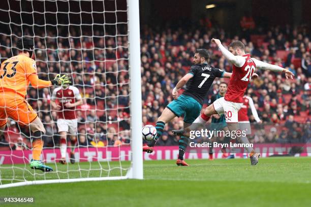 Shane Long of Southampton scores his sides first goal during the Premier League match between Arsenal and Southampton at Emirates Stadium on April 8,...