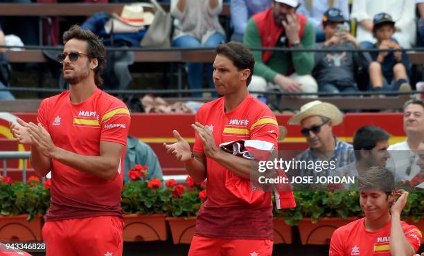 Spain's Rafa Nadal and Spain's Feliciano Lopez applaud during the Davis Cup quarter-final tennis match between Spain's David Ferrer and Germany's...