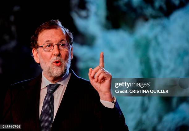 Spanish Prime Minister Mariano Rajoy speaks during the national convention of ruling 'Popular Party' PP in Sevilla on April 8, 2018. / AFP PHOTO /...