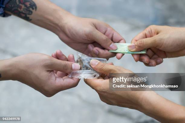 drug addict buying narcotics and paying - smoking death stock pictures, royalty-free photos & images