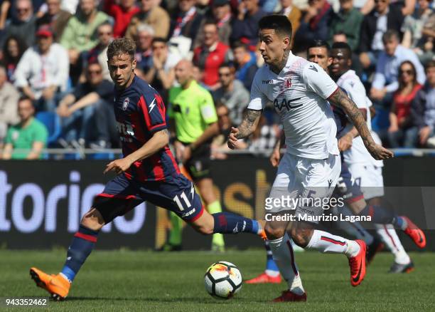 Federico Ricci of Crotone competes for the ball with Erick Pulgar of Bologna during the serie A match between FC Crotone and Bologna FC at Stadio...