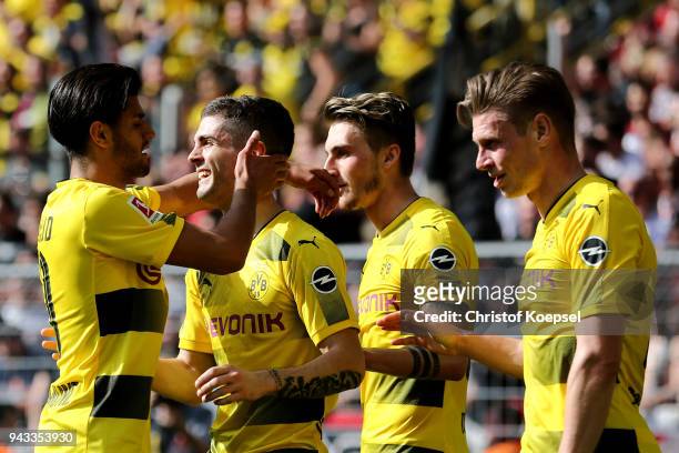 Christian Pulisic of Dortmund celebrates the first goal with Mahmoud Dahoud of Dortmund during the Bundesliga match between Borussia Dortmund and VfB...