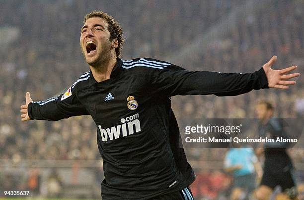 Gonzalo Higuain of Real Madrid celebrates scoring the second goal during the La Liga Match between Valencia and Real Madrid at Estadio Mestalla on...