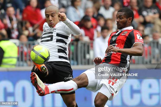 Rennes' French midfielder Wahbi Khazri vies with Nice's Brasilian defender Marlon Santos during the French L1 football match Nice vs Rennes on April...