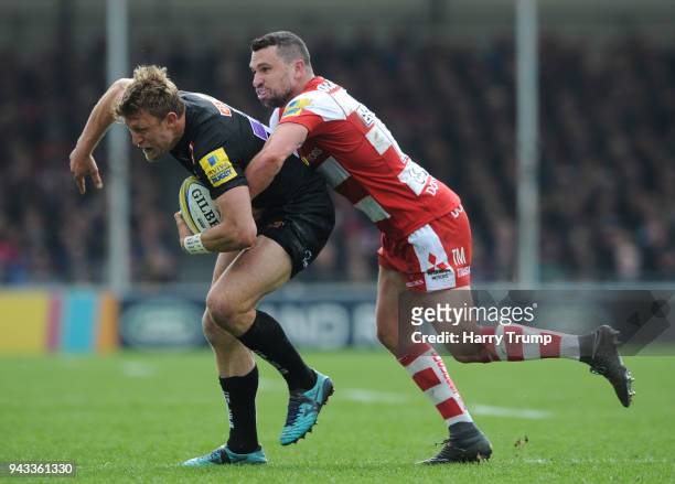 Lachie Turner of Exeter Chiefs is tackled by Tom Marhsall of Gloucester during the Aviva Premiership match between Exeter Chiefs and Gloucester Rugby...