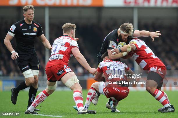 Luke Cowan-Dickie of Exeter Chiefs is tackled by Owen Williams of Gloucester during the Aviva Premiership match between Exeter Chiefs and Gloucester...
