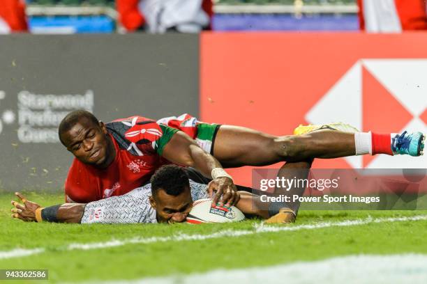 Jerry Tuwai of Fiji fights with Willy Ambaka of Kenya during the HSBC Hong Kong Sevens 2018 match between Fiji and Kenya on April 8, 2018 in Hong...