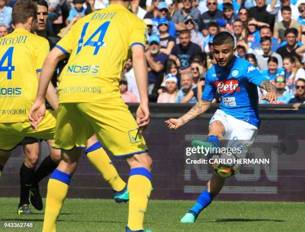 Napoli's Italian striker Lorenzo Insigne kicks the ball during the Italian Serie A football match SSC Napoli vs AC Chievo Verona on April 8, 2018 at...