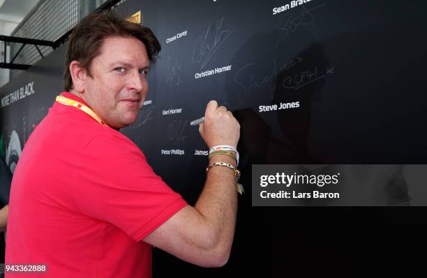 Chef and TV personality James Martin prepares to be driven by David Coulthard in an Aston Martin Vanquish S as part of F1 Hotlaps before the Bahrain...