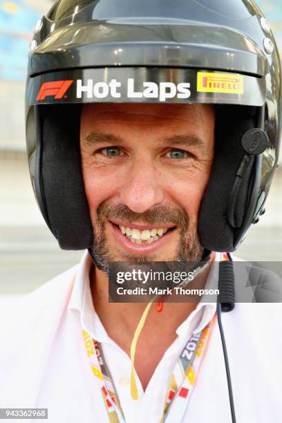 Peter Phillips prepares to be driven by David Coulthard in an Aston Martin Vanquish S as part of F1 Hotlaps before the Bahrain Formula One Grand Prix...