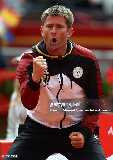 Captain Michael Kohlmann celebrates a point for Philipp Kohlschreiber of Germany during his match against David Ferrer of Spain during day three of...